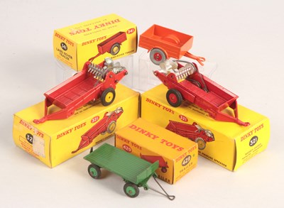 Lot 379 - Dinky Toys Group of 4 x Trailers INC RED PLASTIC HUB & YELLOW PLASTIC HUB MANURE SPREADERS